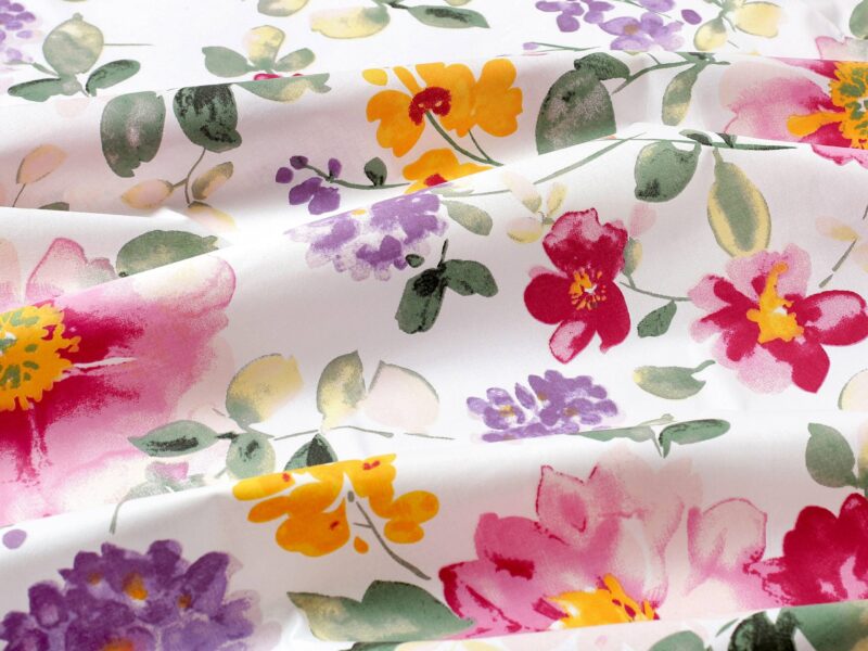 100% Cotton fabric violet blossoms on white by Stofex.