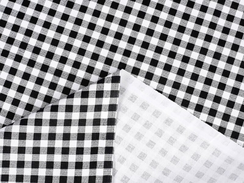 Cotton fabric black checkered by Stofex.