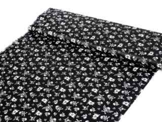 Cotton fabric white skulls on black by Stofex.