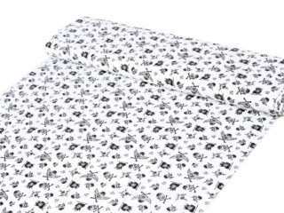 Cotton fabric black skulls on white by Stofex.