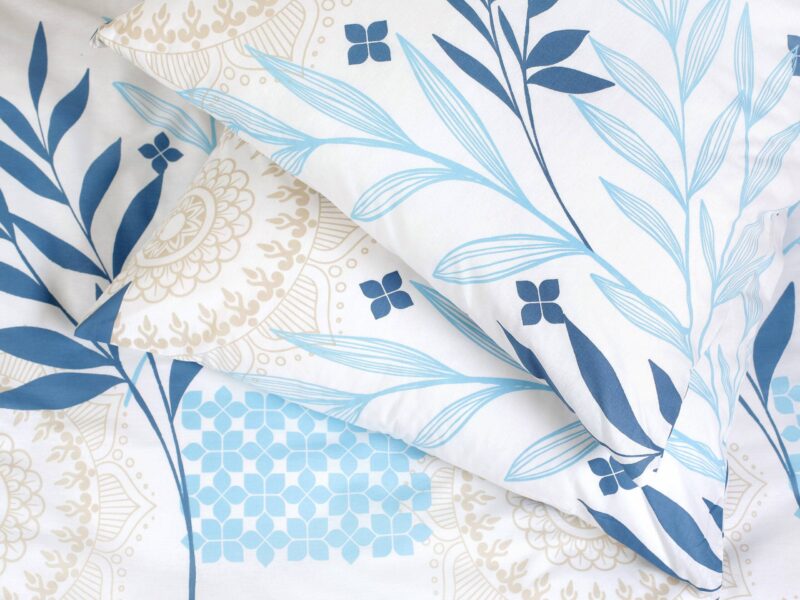 Satin bed linen with blue leaves and manadalas by Stofex.