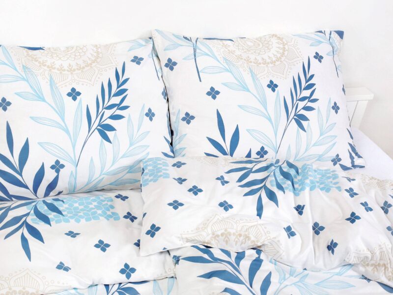 Satin bed linen with blue leaves and manadalas by Stofex.