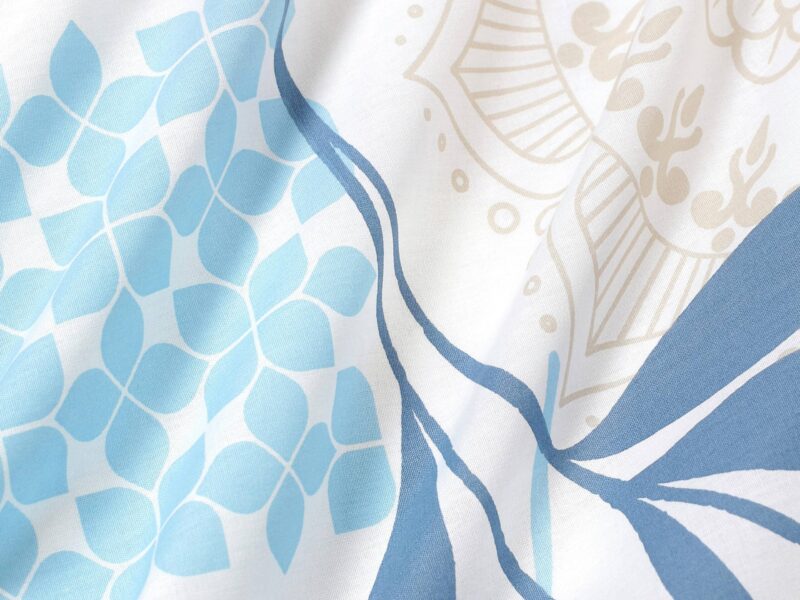 Satin bed linen with blue leaves and manadalas by Stofex.