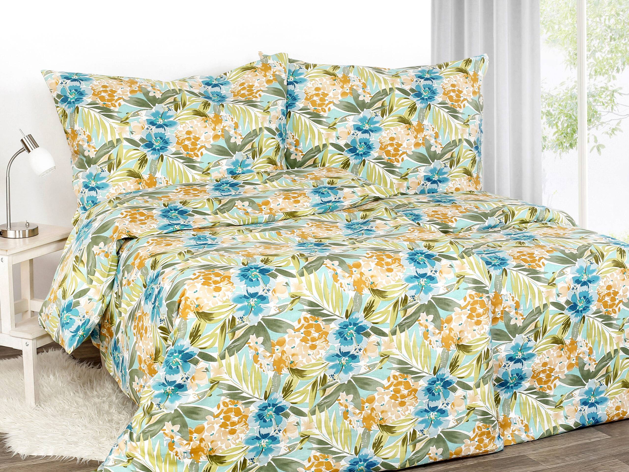 Green linen bedding with blue flowers by Stofex.