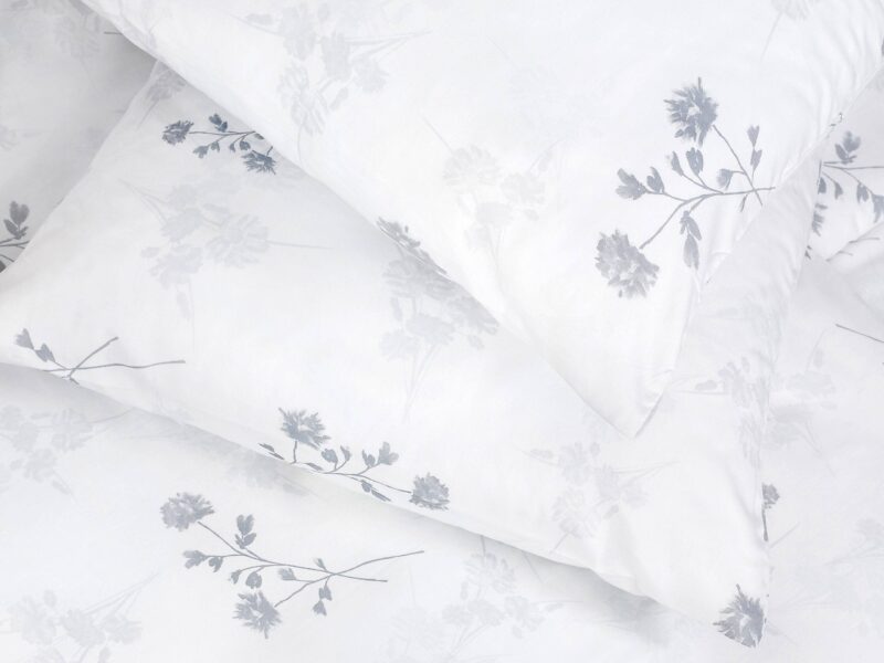 Satin bed linen with grey cornflowers by Stofex.