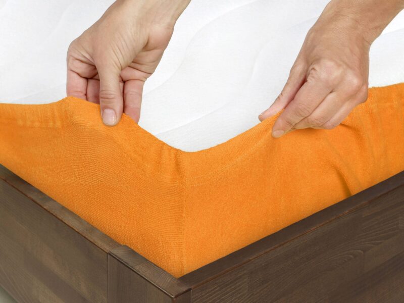 Terry fitted sheet orange for high mattresses by Stofex.