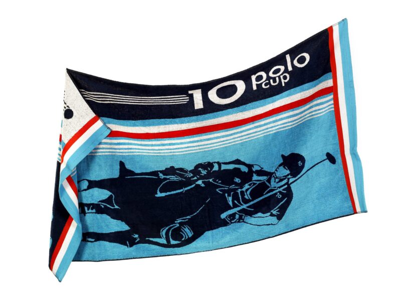 Large beach towel with blue polo by Stofex.