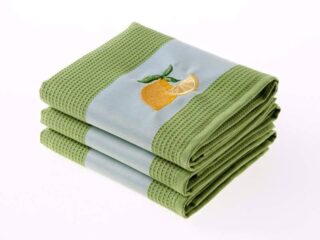 Waffle kitchen towel with lemon on green background from 100% cotton.