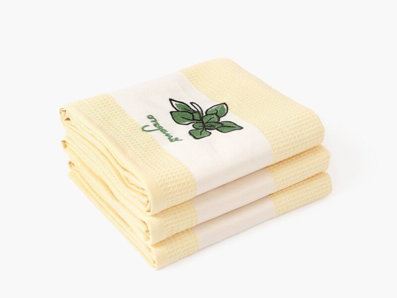 Waffle kitchen towel with oregano on yellow background from 100% cotton.