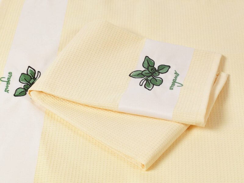 Waffle kitchen towel with oregano on yellow background from 100% cotton.