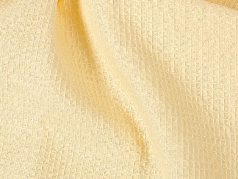 Waffle kitchen towel with oregano on yellow background from 100% cotton.