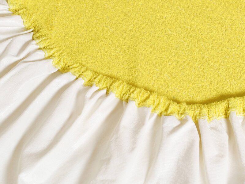 Waterproof terry fitted sheet light yellow by Stofex.