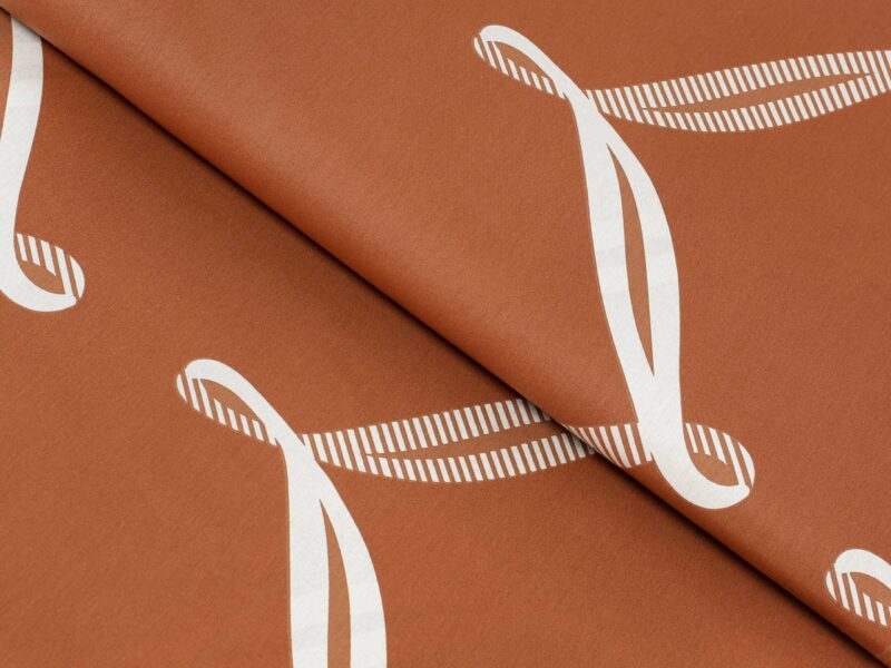 Cotton fabric white ribbon on brown by Stofex.