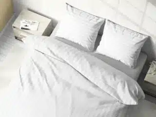 White damask bed linen with 2 cm stripes by Stofex.