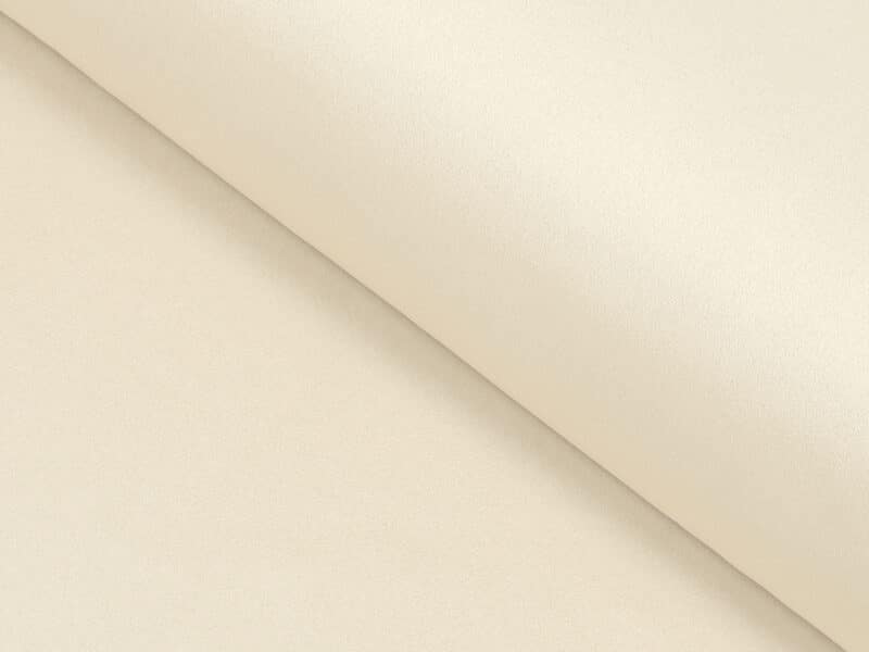 Blackout fabric cream by Stofex.