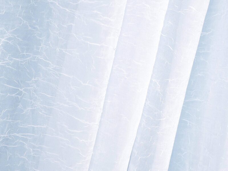 Cressed voile white with sewn-in weights 1031 by Stofex.