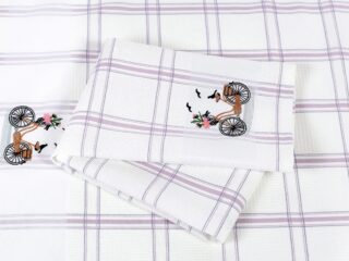 Waffle kitchen towel with bike and purple stripes from 100% cotton.