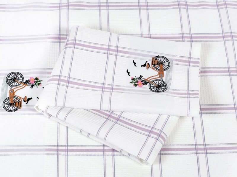 Waffle kitchen towel with bike and purple stripes from 100% cotton.