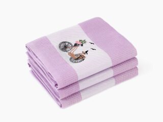 Waffle kitchen towel with bike on purple background from 100% cotton by Stofex.