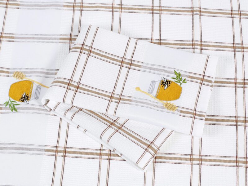 Waffle kitchen towel with honey jar and brown stripes from 100% cotton.