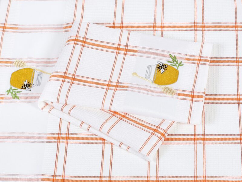 Waffle kitchen towel with honey jar and orange stripes from 100% cotton.