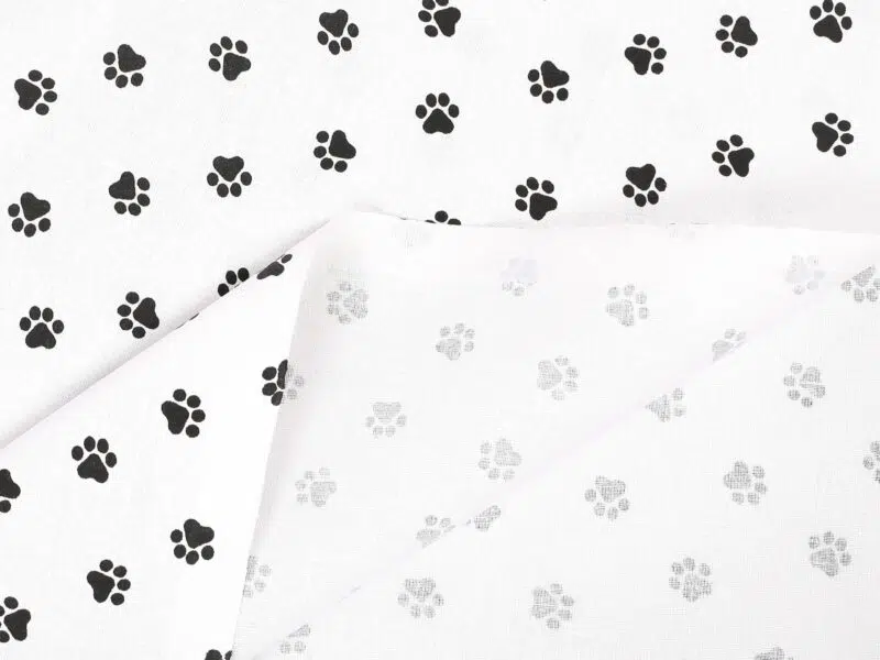 Cotton fabric black paws by Stofex.