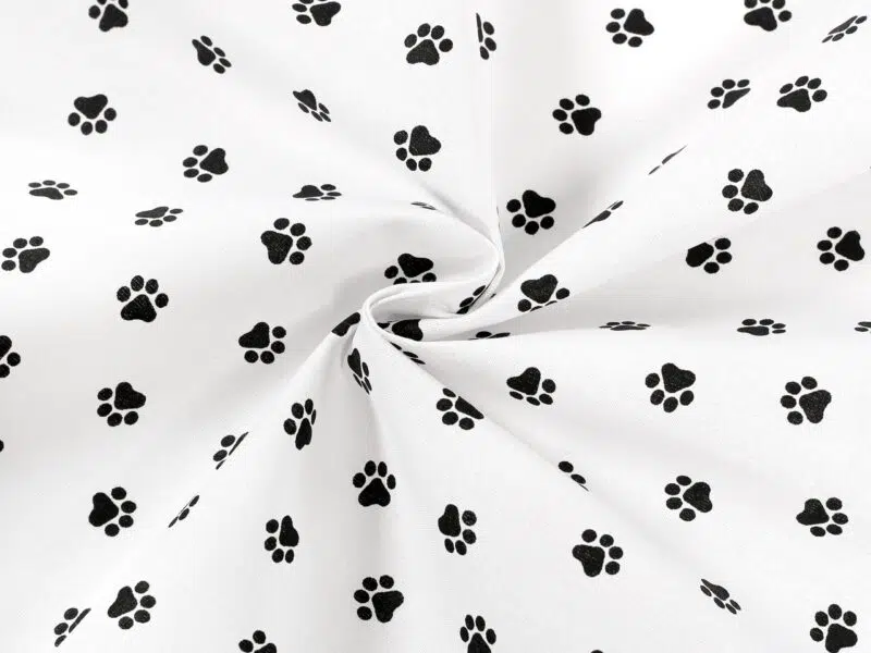 Cotton fabric black paws by Stofex.