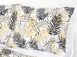 Satin bed linen with golden-black palm leaves by Stofex.