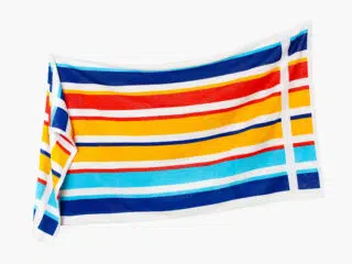 Large beach towel with colourful stripes by Stofex.