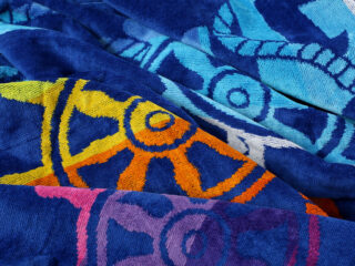 Large beach towel - rudders on dark blue by Stofex.