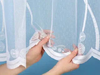 Jacquard sheer curtain stems with leaves pattern 49820 by Stofex.