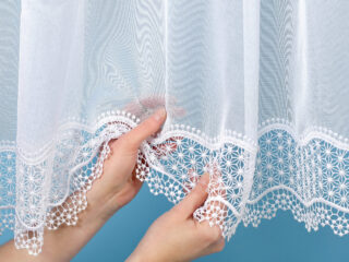 Jacquard sheer curtain with lace pattern 125229 by Stofex.