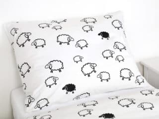 Kids' cotton bed linen black sheep on white by Stofex.