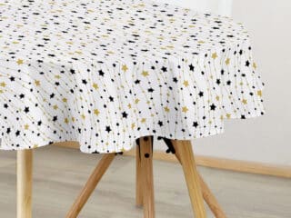 Christmas oval cotton tablecloth gold and black stars on white by Stofex.