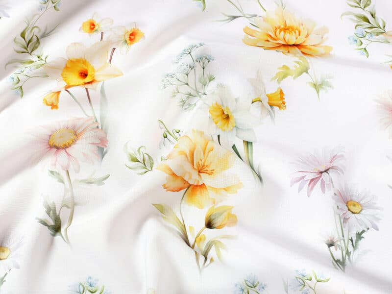 Teflon fabric spring flowers on white width 145 cm by Stofex.