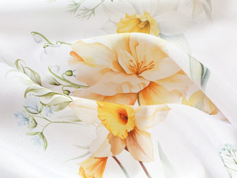 Teflon fabric spring flowers on white width 145 cm by Stofex.